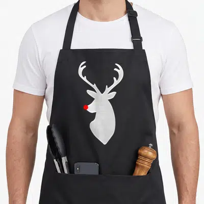 Hip christmas apron - White reindeer head silhouette with single red nose in minimalist style — shown on a black cotton canvas apron against a white background